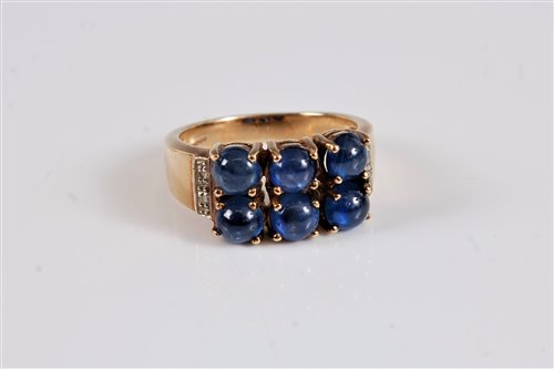 Lot 2591 - A 9ct sapphire and diamond ring, the six round...