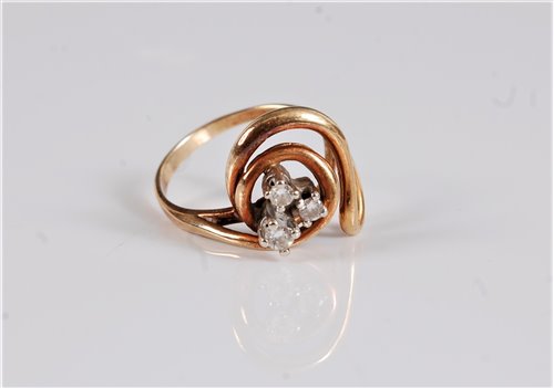 Lot 2644 - A three stone diamond ring, the three round...