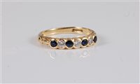 Lot 2657 - An 18ct sapphire and diamond ring, the...