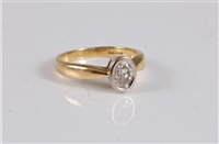 Lot 2651 - An 18ct diamond solitaire ring, the oval...