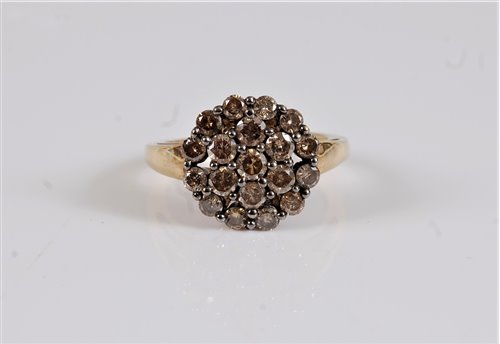 Lot 2621 - A 9ct diamond cluster ring, the chocolate...