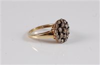 Lot 2621 - A 9ct diamond cluster ring, the chocolate...