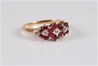 Lot 2576 - A 9ct ruby and diamond highlight ring, the...