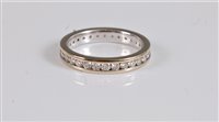 Lot 2648 - An 18ct diamond eternity ring, the full hoop...