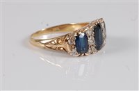 Lot 2593 - An 18ct sapphire and diamond ring, the central...