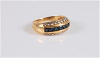 Lot 2658 - An 18ct sapphire and diamond ring, the central...