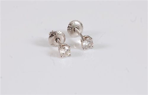 Lot 2617 - A pair of platinum Tiffany diamond earstuds,...