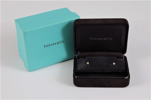 Lot 2615 - A pair of platinum Tiffany diamond ear studs,...