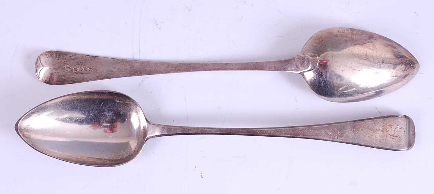 Lot 1163 - A pair of George III silver stuffing spoons,...