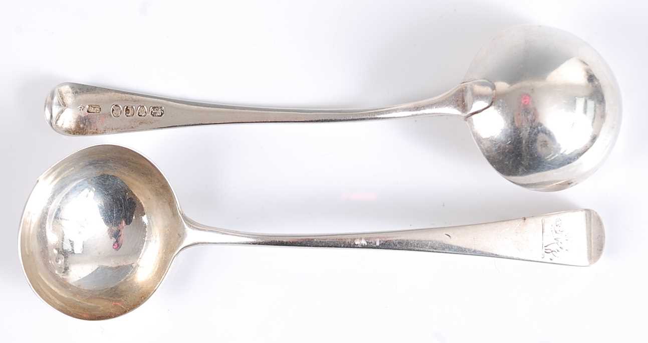 Lot 1170 - A pair of George III silver sauce ladles, in...