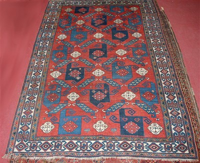 Lot 1555 - A circa 1900 Persian woollen Kazak rug, the...