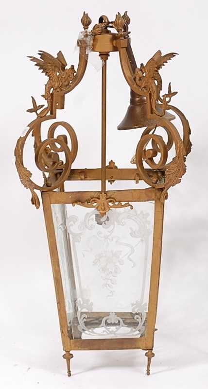 Lot 1394 - A gilt metal hanging lantern, set with winged...