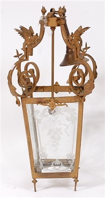 Lot 1394 - A gilt metal hanging lantern, set with winged...