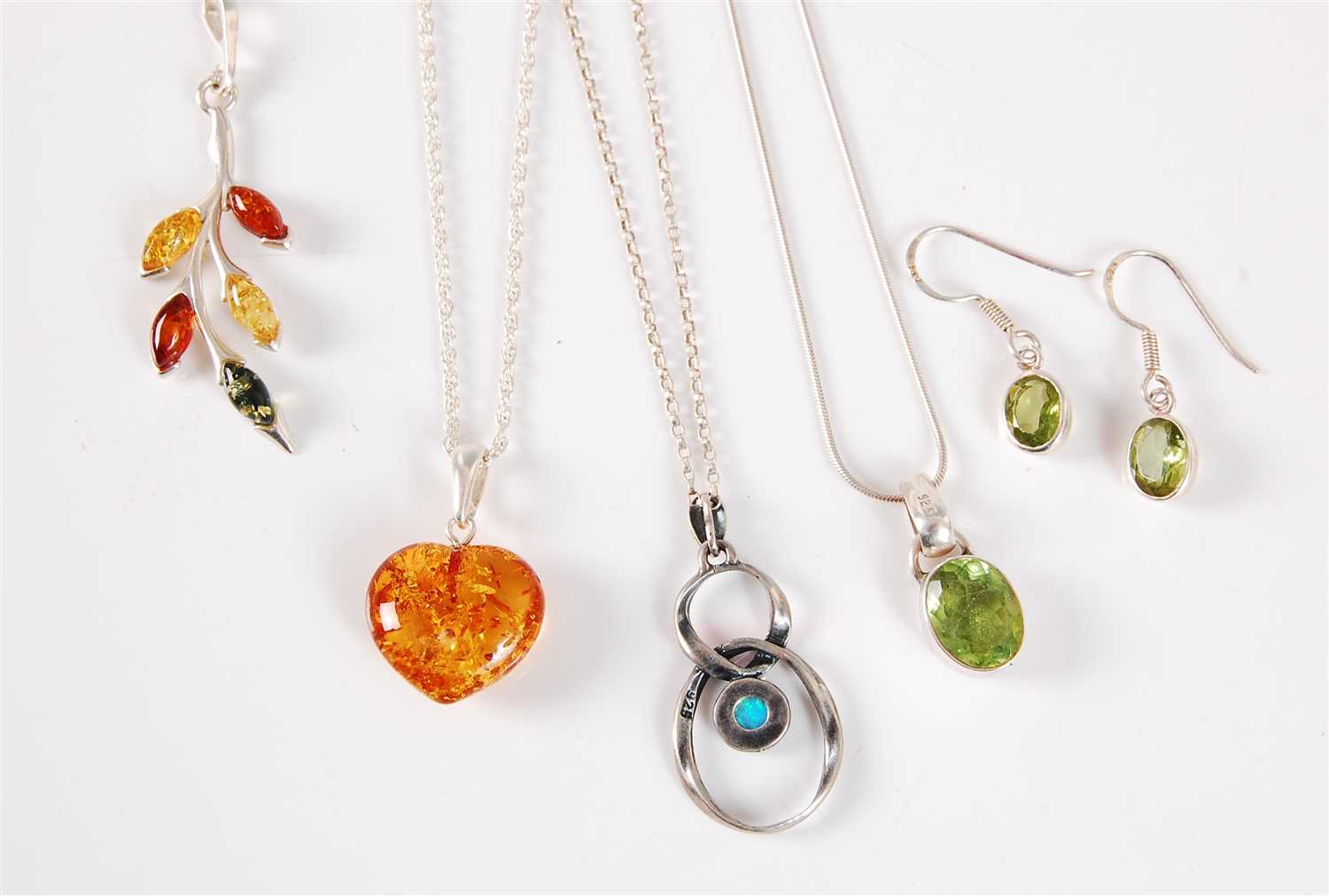 Lot 301 - Three gemset necklaces, to include an amber...