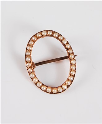 Lot 318 - A seed pearl circlet brooch, the oval circlet...