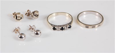Lot 319 - Two 9ct rings, the first a sapphire and...