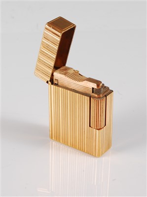 Lot 331 - A gilt metal lighter by Dupont, the...