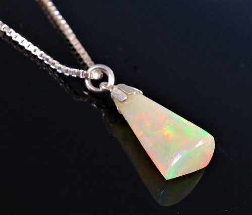 Lot 2584 - An opal pendant, the pear shaped opal, 20mm...