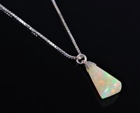 Lot 2584 - An opal pendant, the pear shaped opal, 20mm...