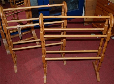 Lot 1114 - A pair of modern beech towel rails