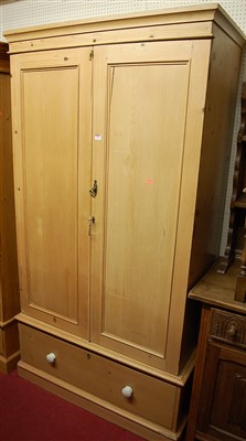 Lot 1120 - A reclaimed pine double door wardrobe, having...