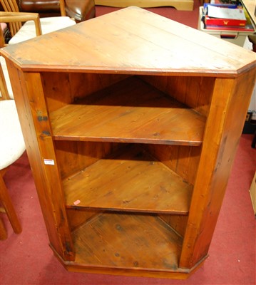 Lot 1124 - A stained pine hanging open corner shelf,...