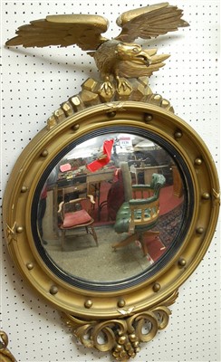 Lot 1136 - A Regency style gilt wood convex circular wall...