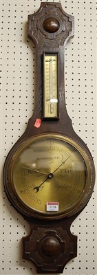 Lot 1138 - A 1930s oak two dial aneroid wheel barometer