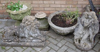 Lot 1143 - A reconstituted stone garden figure of a...