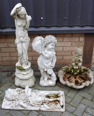 Lot 1145 - A reconstituted stone and white painted figure...