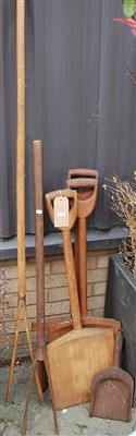 Lot 1148 - Two rustic softwood shovels, together with a...