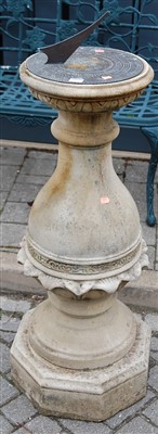 Lot 1156 - A reconstituted stone pedestal sundial having...