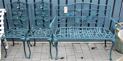 Lot 1157 - A contemporary green painted pierced metal two...