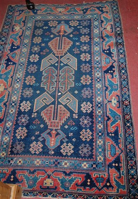 Lot 1164 - A Persian woollen blue ground rug, having all...