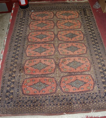 Lot 1169 - A machine woven bokhara rug, 200 x 130 cm