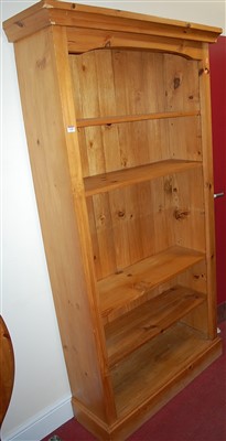 Lot 1180 - A modern pine freestanding open bookshelf...