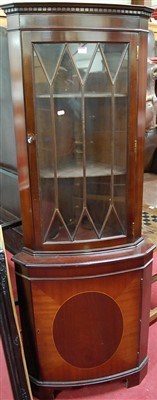 Lot 1199 - A reproduction mahogany freestanding corner...