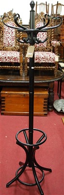 Lot 1202 - A contemporary black painted hatstand having...