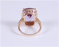 Lot 1294 - A 14k amethyst and diamond ring, the mixed cut...