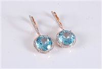 Lot 1219 - A pair of 14k topaz and diamond earrings, the...