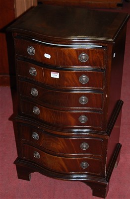 Lot 1254 - A reproduction mahogany serpentine front...