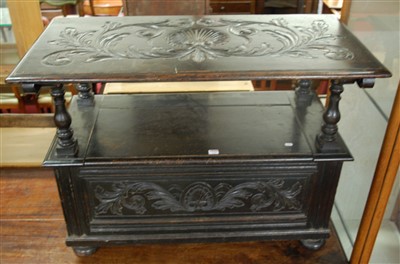 Lot 1262 - An early 20th century ebonised and relief...