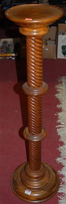 Lot 1312 - A contemporary beech spiral turned plant stand,...