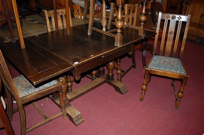 Lot 1331 - A 1930s oak drawleaf dining table, max. length...