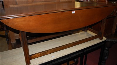 Lot 1359 - A mahogany dropleaf coffee table, raised on...