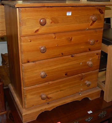 Lot 1279 - A modern pine chest of four long drawers,...