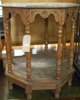 Lot 1343 - A circa 1900 carved oak two tier occasional table