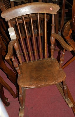 Lot 1387 - An early 20th century elm seat and beech...