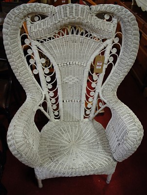 Lot 1394 - A white painted wicker peacock chair