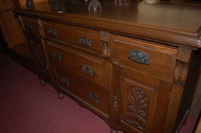 Lot 1301 - An Edwardian walnut and floral relief carved...